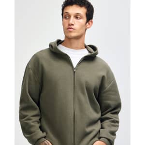 A unisex full zip hooded sweatshirt in olive green, featuring a relaxed fit and a hood. Includes a logo.