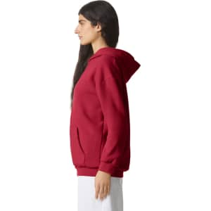 A unisex hooded sweatshirt in red, featuring a front pocket and a relaxed fit. It has a logo on the front.