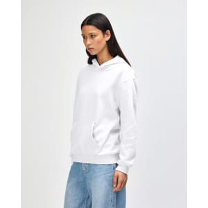 A unisex hooded sweatshirt in white, featuring a front pouch pocket and a logo on the side.