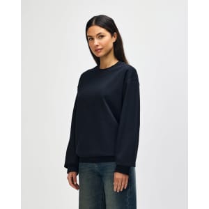 A black Gildan Softstyle adult sweatshirt displayed on a model, featuring a simple design and a logo.