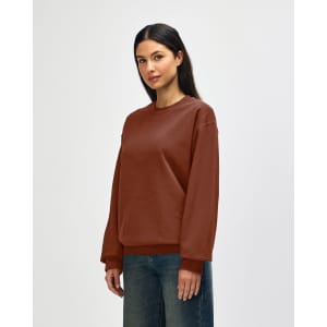 A brown Gildan Softstyle adult sweatshirt with a classic fit and long sleeves, featuring a logo.