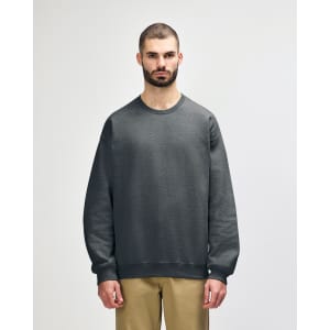A green sweatshirt is displayed, featuring a classic crew neck and ribbed cuffs, with a logo on the front.