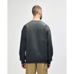 A green Gildan Softstyle adult sweatshirt viewed from the back, featuring a simple design and loose fit.