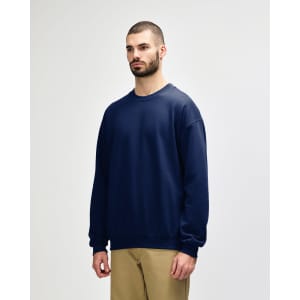 A navy blue Gildan Softstyle adult sweatshirt with a crew neck and long sleeves, featuring a logo.