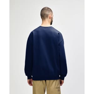 A navy Gildan Softstyle adult sweatshirt with a plain back, featuring a fitted design and long sleeves.