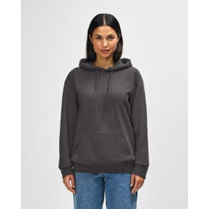 A hooded sweatshirt in khaki green, featuring a front pocket and a logo, worn by a model.