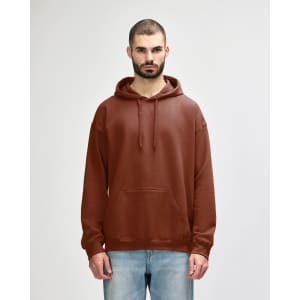 A brown Gildan Softstyle adult hooded sweatshirt worn by a woman, featuring a front pocket and drawstring hood.