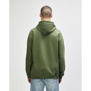 A green Gildan Softstyle adult hooded sweatshirt viewed from the back, featuring a hood and long sleeves.