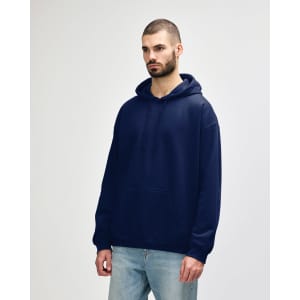 A navy Gildan Softstyle adult hooded sweatshirt featuring a front pocket and a logo. Worn by a model in casual attire.