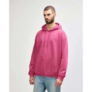 A pink Gildan Softstyle adult hooded sweatshirt displayed on a model. The sweatshirt features a front pocket and a hood.