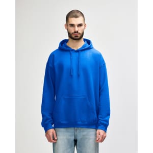 A blue Gildan Softstyle adult hooded sweatshirt on a model, featuring a front pouch pocket and drawstring hood.