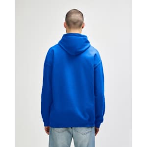 A blue hooded sweatshirt with a spacious back and attached hood, featuring a logo.