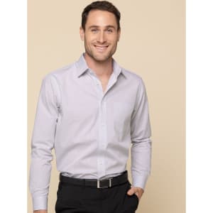 A button-up shirt in light purple, worn by a smiling man. Features a pocket and a subtle logo.