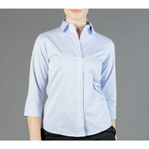 A light blue, long-sleeved shirt with a collar and buttons, featuring a fitted design. It has a branding logo.