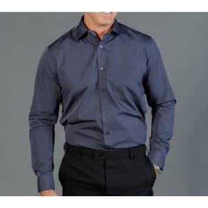 A button-up shirt in dark grey, featuring a pocket and long sleeves, worn by a model against a grey background.