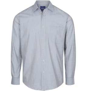 A light blue button-up shirt with long sleeves and a chest pocket. It features a branding logo on the collar.