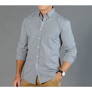 A button-up shirt in black and white gingham pattern, featuring long sleeves and a collar. It has a logo on the chest.