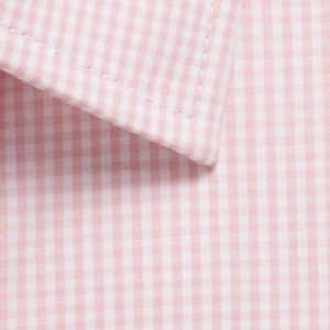 A close-up of a pink and white gingham patterned fabric, featuring a collar of a button-up shirt.
