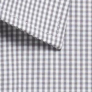 A button-up shirt featuring a grey and white gingham pattern with a detailed collar. It has branding visible.
