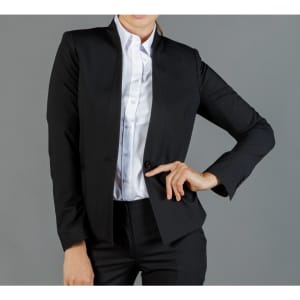 A black cardigan jacket featuring a fitted design and a single button closure. The model wears a collared white shirt underneath.
