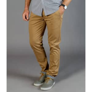 A pair of tan chinos featured with a casual grey shirt and grey shoes, displaying a stylish, fitted design.