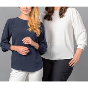 A navy blue top with shirred cuffs alongside a white top, both with a loose fit and round necklines.