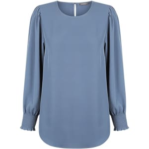 A blue blouse with shirred cuffs and a round neckline, featuring long sleeves and a back keyhole detail.