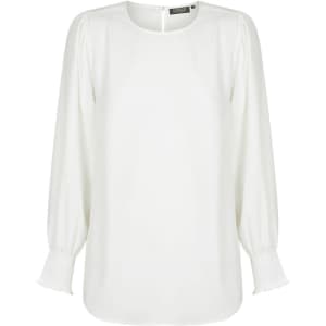A white blouse with a round neckline, shirred cuffs, and long sleeves. It features a subtle, elegant style and has a branding label.