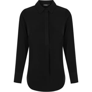 A black long-sleeve shirt with a half placket and a collar, featuring a logo at the neck.
