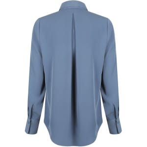 A light blue long-sleeve shirt featuring a half placket and back pleat, also has a logo.
