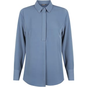 A blue Quinn 1/2 placket shirt with long sleeves and a collar, featuring a logo.