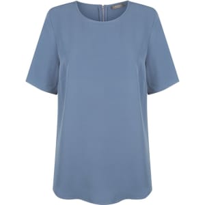 A light blue short sleeve shirt with a round neckline and a back zipper, featuring a subtle brand logo.
