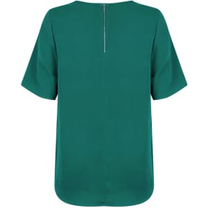 A short sleeve shirt in a vibrant teal colour, featuring a hidden zip at the back and a relaxed fit.