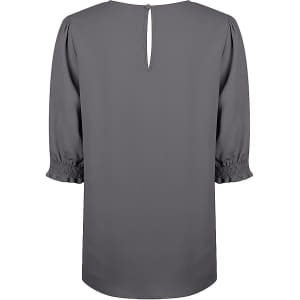 A grey blouse with shirred cuffs and a keyhole back detail. It features short, puffed sleeves and a smooth finish.