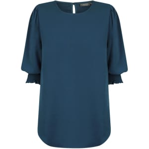 A teal blouse featuring shirred cuffs and a keyhole back detail. The fabric is smooth and flowing.