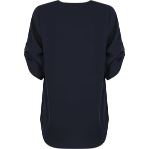 A navy blue Reese V Neck shirt with a loose fit and rolled sleeves, featuring a logo on the back.