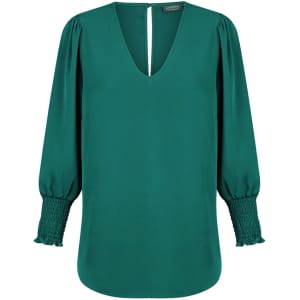 A green Cleo V Neck shirt with balloon sleeves and smocked detailing at the cuffs, featuring a keyhole back.