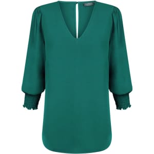 A green Cleo V Neck shirt with puffed sleeves and a smocked cuff detail, featuring a keyhole back.