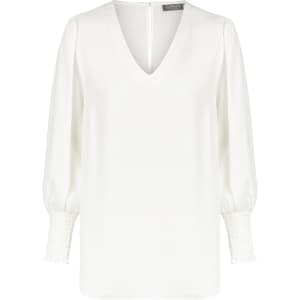 A white V-neck shirt with puffed sleeves and smocked cuffs, featuring a subtle branding label on the back.