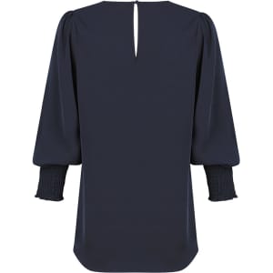 A navy blue shirt with puffed sleeves and smocked cuffs, featuring a keyhole back design and no visible branding.