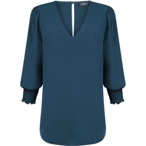 A teal Cleo V Neck shirt with three-quarter sleeves and smocked cuffs, featuring a keyhole back detail.