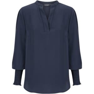 A navy blue long sleeve top with a relaxed fit and gathered detailing at the cuffs. It features a partial collar.