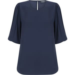 Navy blue Poppy Puff Sleeve Top with a relaxed fit and short puff sleeves. It features a subtle back opening and includes a logo.