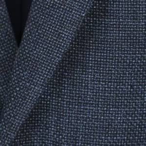 A blazer in a textured navy blue fabric, showcasing a subtle woven pattern. Features a logo on the label.