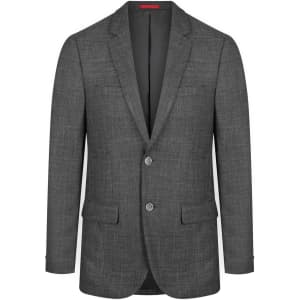 A grey blazer with a textured fabric, featuring two buttons and two front pockets. It has a simple logo on the interior.