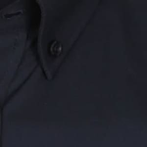 A dark navy button-up shirt with a collar and button detail, featuring a small logo.