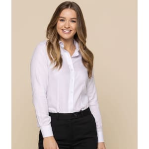 A button-up shirt in white, featuring long sleeves and a classic collar, worn by a smiling model.