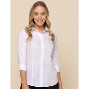 A model wearing a white button-up shirt with three-quarter sleeves, featuring a logo on the chest.