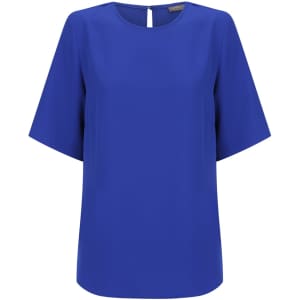 A blue short sleeve top with a round neckline and a back keyhole detail. It has a logo on the label.