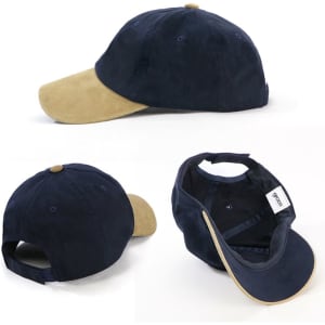 An unstructured navy blue cap with a suede beige peak, featuring a logo and an adjustable strap at the back.